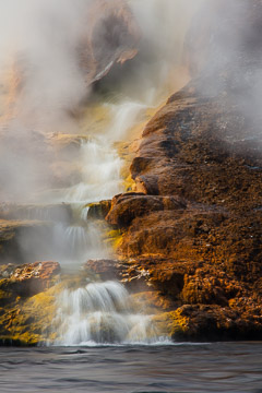 Water from the Grand Prismatic Spring flows into Firehole River